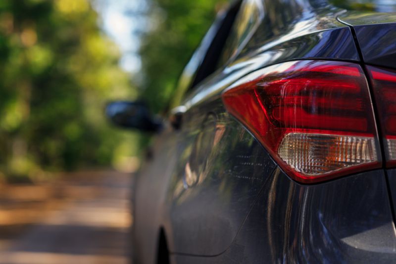Closeup of a sedan tail light during the day