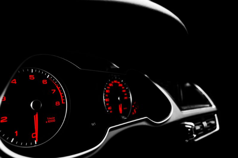 Dark closeup image of a car dashboard